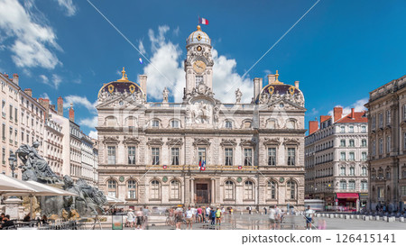 Hyperlapse of Hotel de Ville de Lyon, the historic city hall of Lyon, France. People stroll near the fountain on the square timelapse. Hyperlapse of Hotel de Ville de Lyon, the historic city hall of Lyon, France. People stroll near the fountain on the square timelapse. 126415141