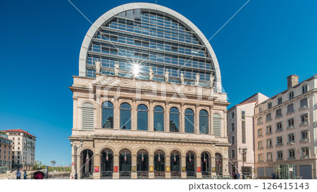 Hyperlapse of Lyon's opera house featuring neoclassical architecture combined with a modern glass dome roof. France Hyperlapse of Lyon's opera house featuring neoclassical architecture combined with a modern glass dome roof. France 126415143