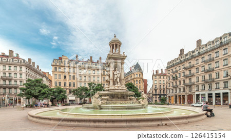 Hyperlapse of Place des Jacobins in Lyon, France, featuring the ornate Fontaine des Jacobins surrounded by historic buildings. 126415154