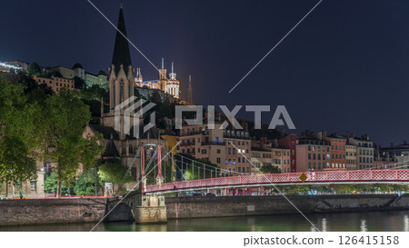 Timelapse hyperlapse of Saint George Church at night, Quais de Saone and Fourviere Basilica from a footbridge in Vieux Lyon, France Timelapse hyperlapse of Saint George Church at night, Quais de Saone and Fourviere Basilica from a footbridge in Vieux Lyon, France 126415158