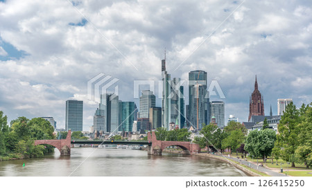 Hyperlapse of Frankfurt's skyscrapers skyline with the bell tower overlooking Alte Brucke. Frankfurt, Germany Hyperlapse of Frankfurt's skyscrapers skyline with the bell tower overlooking Alte Brucke. Frankfurt, Germany 126415250