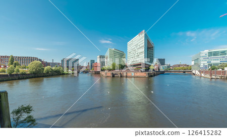 Panorama showing Hamburg HafenCity skyline timelapse at Ericusgraben with a view of modern Spiegel office buildings 126415282