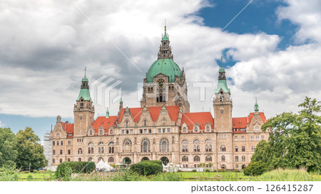 Hyperlapse of Hanover's New Town Hall, a landmark castle-like structure surrounded by park and lake under a cloudy sky. Germany Hyperlapse of Hanover's New Town Hall, a landmark castle-like structure surrounded by park and lake under a cloudy sky. Germany 126415287