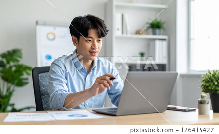Concentrate on document creation in a modern office 126415427