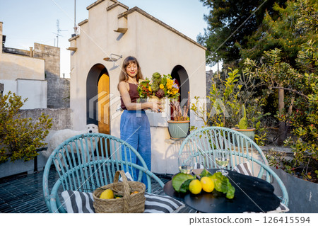 Terrace bouquet and rustic charm in Mediterranean rooftop garden 126415594