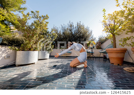 Morning Stretch on a Rooftop Terrace in Southern Italy 126415625