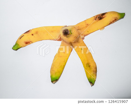 Yellow banana peel on white background Yellow banana peel on white background 126415907