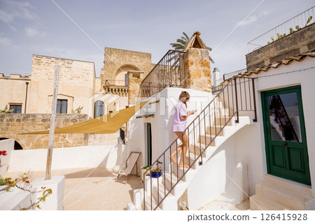 Sunlit steps and historic walls 126415928