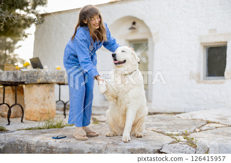 Joyful connection with a fluffy friend 126415957
