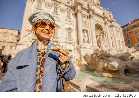 Smiling with a Cannolo by Trevi Fountain 126415969