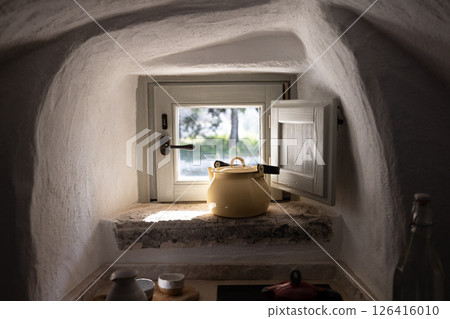 Morning light on a rustic kitchen window 126416010