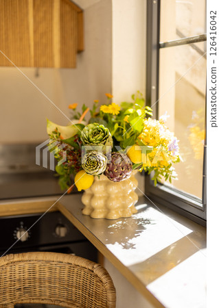 Sunlit Artichoke and Lemon Floral Arrangement Sunlit Artichoke and Lemon Floral Arrangement 126416042