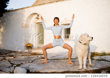 Morning Yoga Flow in Front of Trullo 126416059