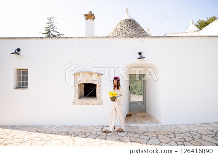 Trullo entrance with flowers 126416090