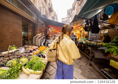 Choosing greens at Sicilian street market 126416126