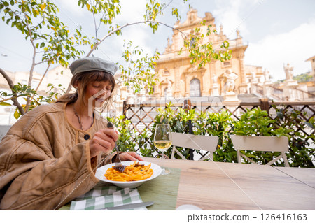 Sicilian pasta alla Norma with cathedral view 126416163