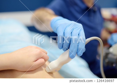 Mammologist doctor examines a woman breasts and lymph nodes using ultrasound. Mammography and ultrasound scanning are main methods of instrumental diagnosis of mammary glands. Breast cancer 126416697