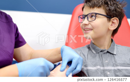 Close up view during of taking a blood sample for examination in a modern laboratory Close up view during of taking a blood sample for examination in a modern laboratory 126416877