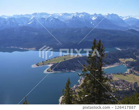 Stunning mountain landscape featuring serene lakes and vibrant greenery in the Alps on a clear sunny day 126417887