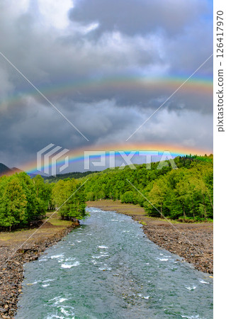 A double rainbow over fertile land and clear waters - Ishikari River 126417970