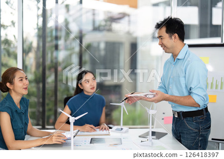 Sustainability and ESG. Professionals engaging in renewable energy project planning. Sustainability and ESG. Professionals engaging in renewable energy project planning. 126418397