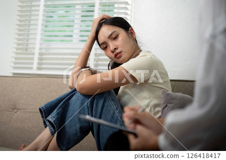 Psychologist and Patient. Emotional therapy session in a cozy setting. 126418417