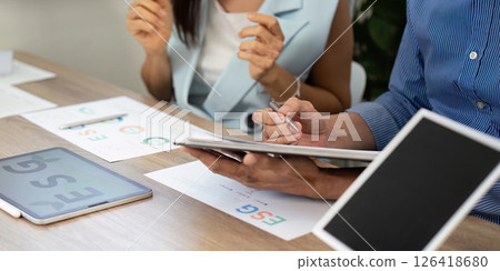 Sustainability in action: Discussing ESG strategies in the office Sustainability in action: Discussing ESG strategies in the office 126418680