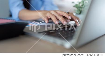 Remote Work Productivity. Close-up of hands typing on laptop for digital transformation. 126418810