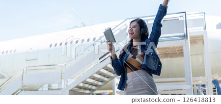 Journey excitement at the airport with traveler celebrating 126418813