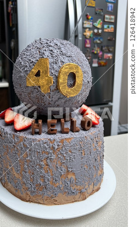 Celebratory 40th Birthday Cake with Chocolate Letters and Strawberry Decoration. Delicious Celebratory 40th Birthday Cake with Chocolate Letters and Strawberry Decoration. Delicious 126418942