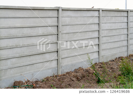 Construction activity of a concrete fence urban setting clear environment wide angle infrastructure Construction activity of a concrete fence urban setting clear environment wide angle infrastructure 126419686