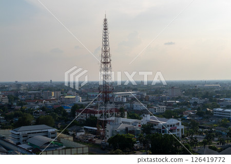 Telecommunication tower overlooking urban landscape city skyline aerial view technology concept 126419772