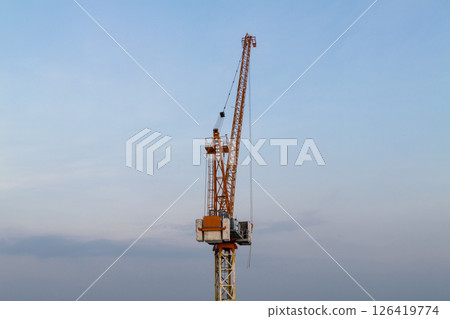 Construction site activity urban environment crane operation daytime industrial perspective Construction site activity urban environment crane operation daytime industrial perspective 126419774