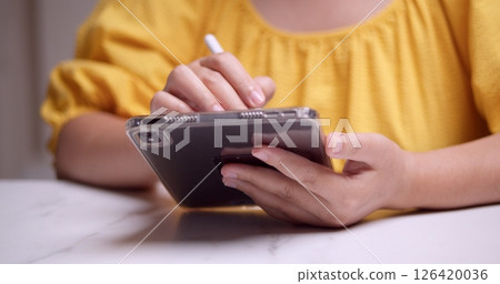 Creative digital note-taking action home office indoor close-up productivity 126420036