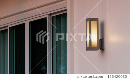 Modern outdoor lighting fixture by sliding glass doors home decor elegant environment daytime view Modern outdoor lighting fixture by sliding glass doors home decor elegant environment daytime view 126420080