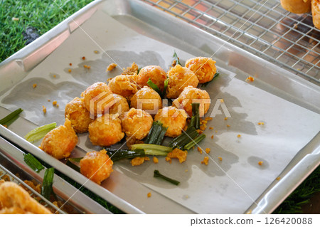 Fried snack delights local market food outdoor setting close-up view culinary adventure 126420088