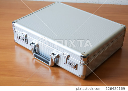 Business attache case wooden surface office setting product minimalistic view 126420169
