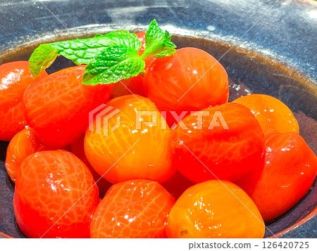 Refreshing marinated fruit tomatoes 126420725
