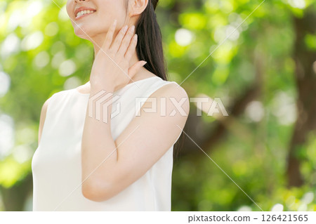 A woman relaxing in the park A woman relaxing in the park 126421565