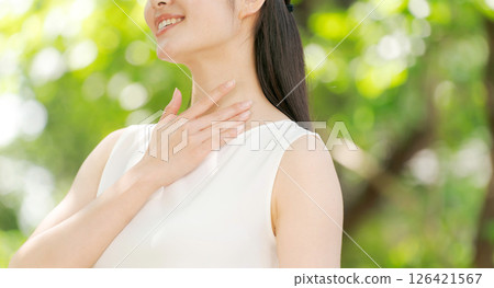 A woman relaxing in the park A woman relaxing in the park 126421567