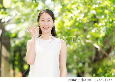 A woman relaxing in the park A woman relaxing in the park 126421757