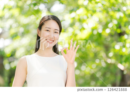 Woman making a circle with her fingers 126421888
