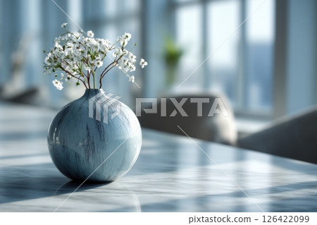 White Flowers in Blue Vase on Marble Table 126422099