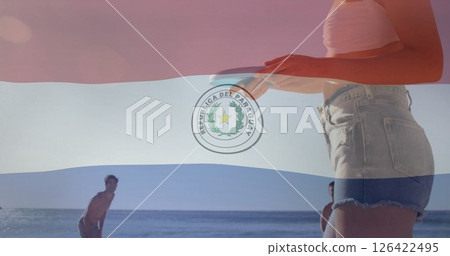 Paraguay flag image over people enjoying beach activities 126422495