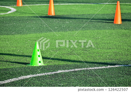 artificial green grass soccer field with training cones artificial green grass soccer field with training cones 126422507