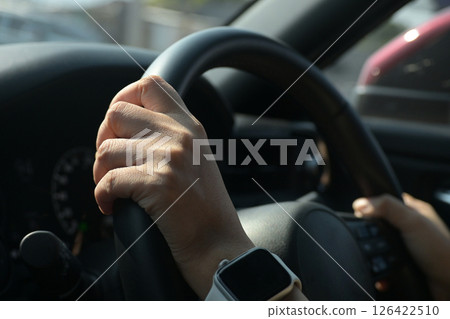 female driver hand hold steering wheel drive vehicle car rode trip travel female driver hand hold steering wheel drive vehicle car rode trip travel 126422510