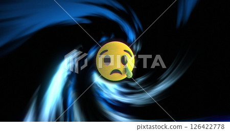 Sad face emoji with tear over swirling blue and black background image 126422778