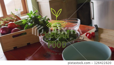 Vegan food image over fresh vegetables and kitchen utensils on wooden table Vegan food image over fresh vegetables and kitchen utensils on wooden table 126422820