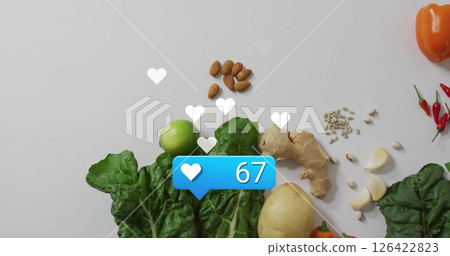 Social media likes image over fresh vegetables and nuts on white background 126422823