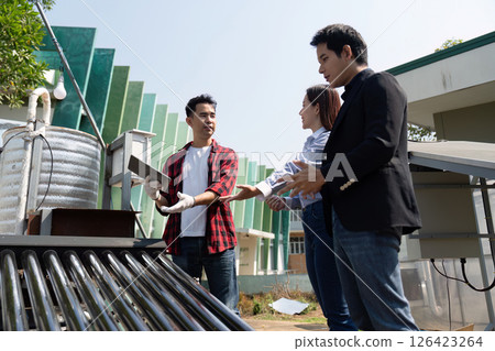 Innovation and Renewable Energy Solutions. A team discussing solar energy installations, emphasizing sustainable practices and teamwork. Innovation and Renewable Energy Solutions. A team discussing solar energy installations, emphasizing sustainable practices and teamwork. 126423264